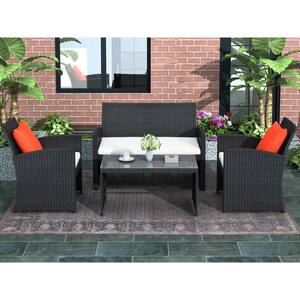 Black 4-Piece Wicker Patio Conversation Set with Beige Cushions and Coffee Table