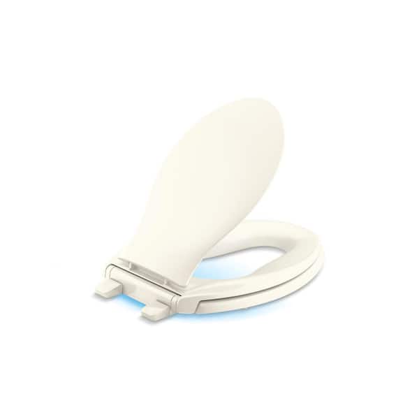 Transitions Elongated Nightlight Quiet-Close Toilet Seat in. Biscuit