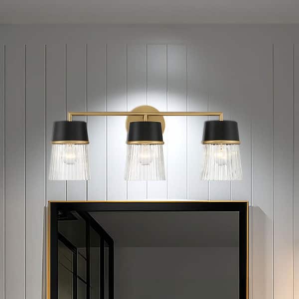 Stamford 24 in. 3-Light Matte Black and Legacy Brass Vanity Light with Clear Ribbed Glass Shades