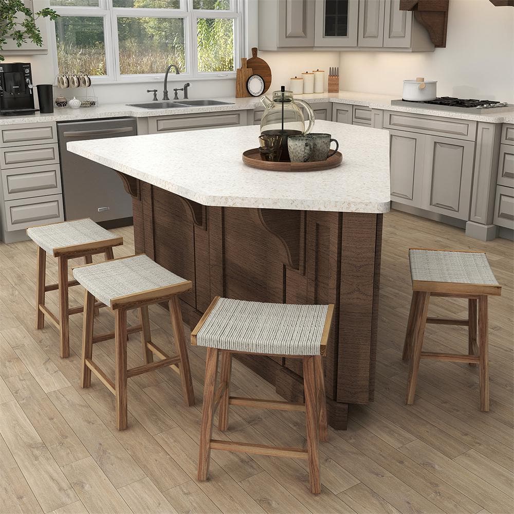 Four natural wood bar stools with seagrass woven seats in a kitchen setting.