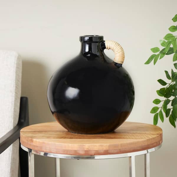 Litton Lane 13 in. Black Jug Inspired Ceramic Decorative Vase with Rattan Wrapped Handle