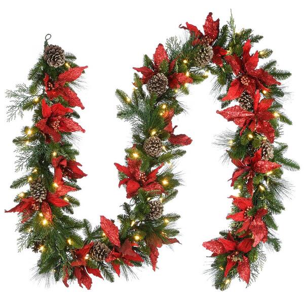 National Tree Company 9 ft. Decorative Collection Feel Real Garland with Red Poinsettia, Gold Edged Cones, Flocked Cedar and 100 Clear Lights