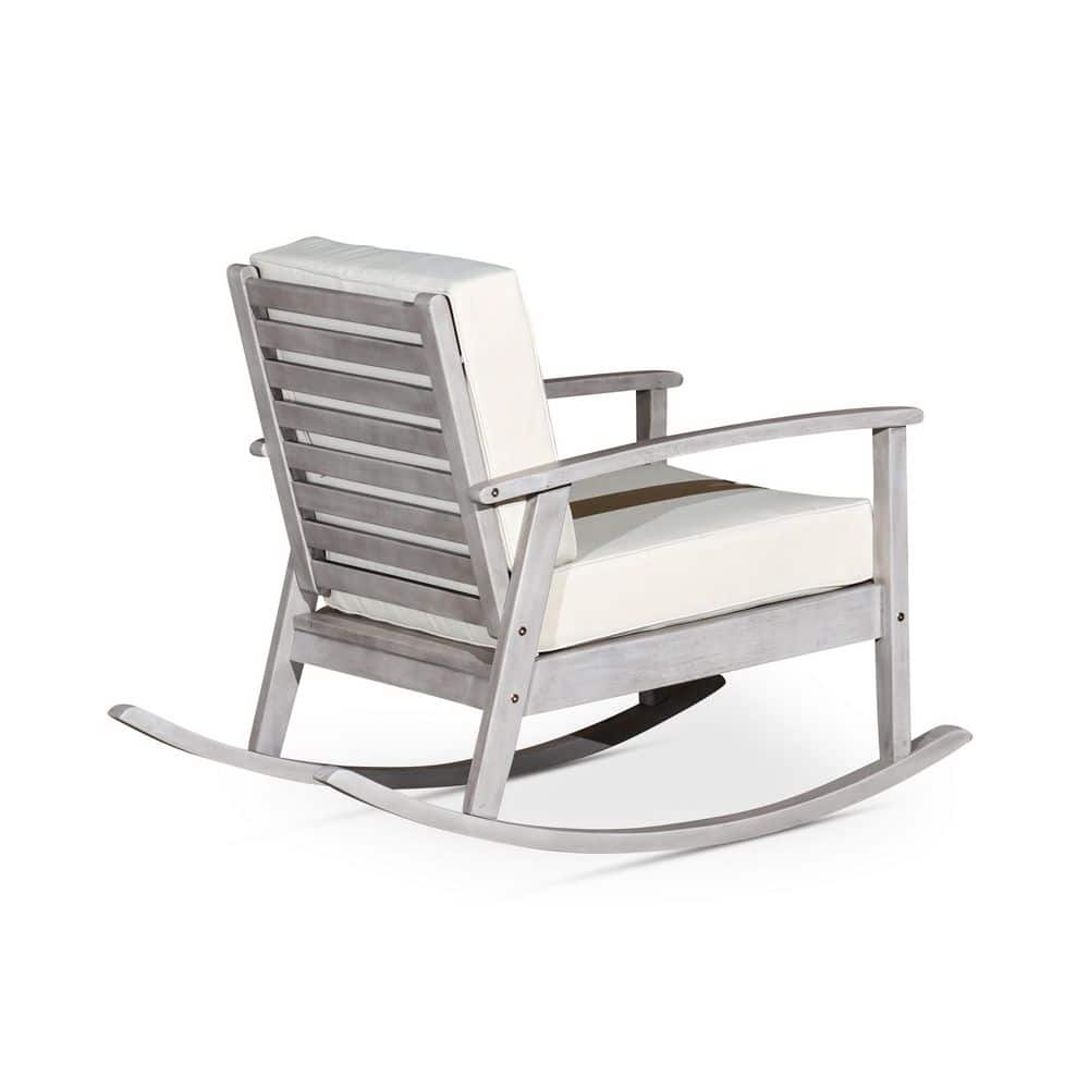 Gray wood rocking chair with beige cushion on a white background.