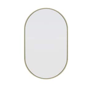 22 in. W x 36 in. H Framed Oval Bathroom Vanity Mirror in Satin Brass