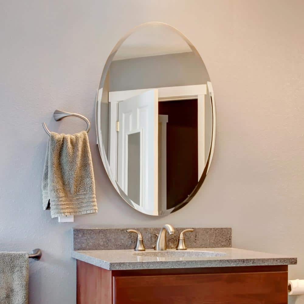 Elegant Oval 22" x 39" Frameless Polished Wall Mirror with Beveled Edge