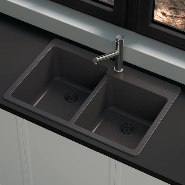 Black kitchen cabinets, granite top, and silver metallic back splash.  Gorgeous new kitchen. Silver round tile…
