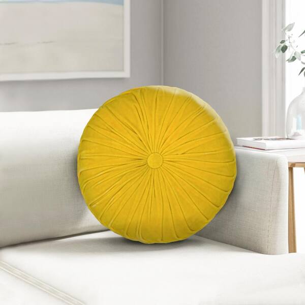 round yellow throw pillow