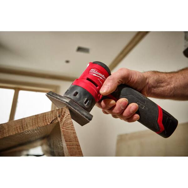 Milwaukee M12 23GA Pin Nailer with M12 FUEL Orbital Detail and M12 High Output CP2.5AH Battery