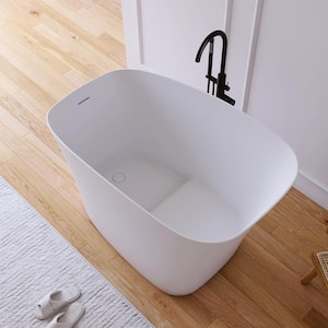 51 in. x 29 in. Stone Resin Solid Surface Flatbottom Freestanding Japanese Soaking Bathtub in White with Seat