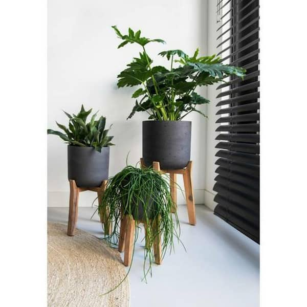 https://images.thdstatic.com/productImages/c74efa70-392d-483f-9431-ed2b3b7a209e/svn/black-washed-potterypots-plant-pots-pfh3024-31-33-4f_600.jpg