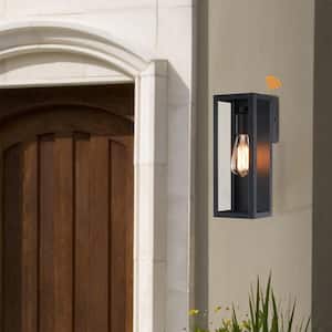 Cali 1-Light 13.15 in. Outdoor Dusk-To-Dawn Sensor Wall Light with Matte Black Finish and Clear Glass Shade