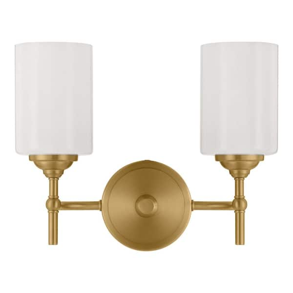 white and brass vanity light