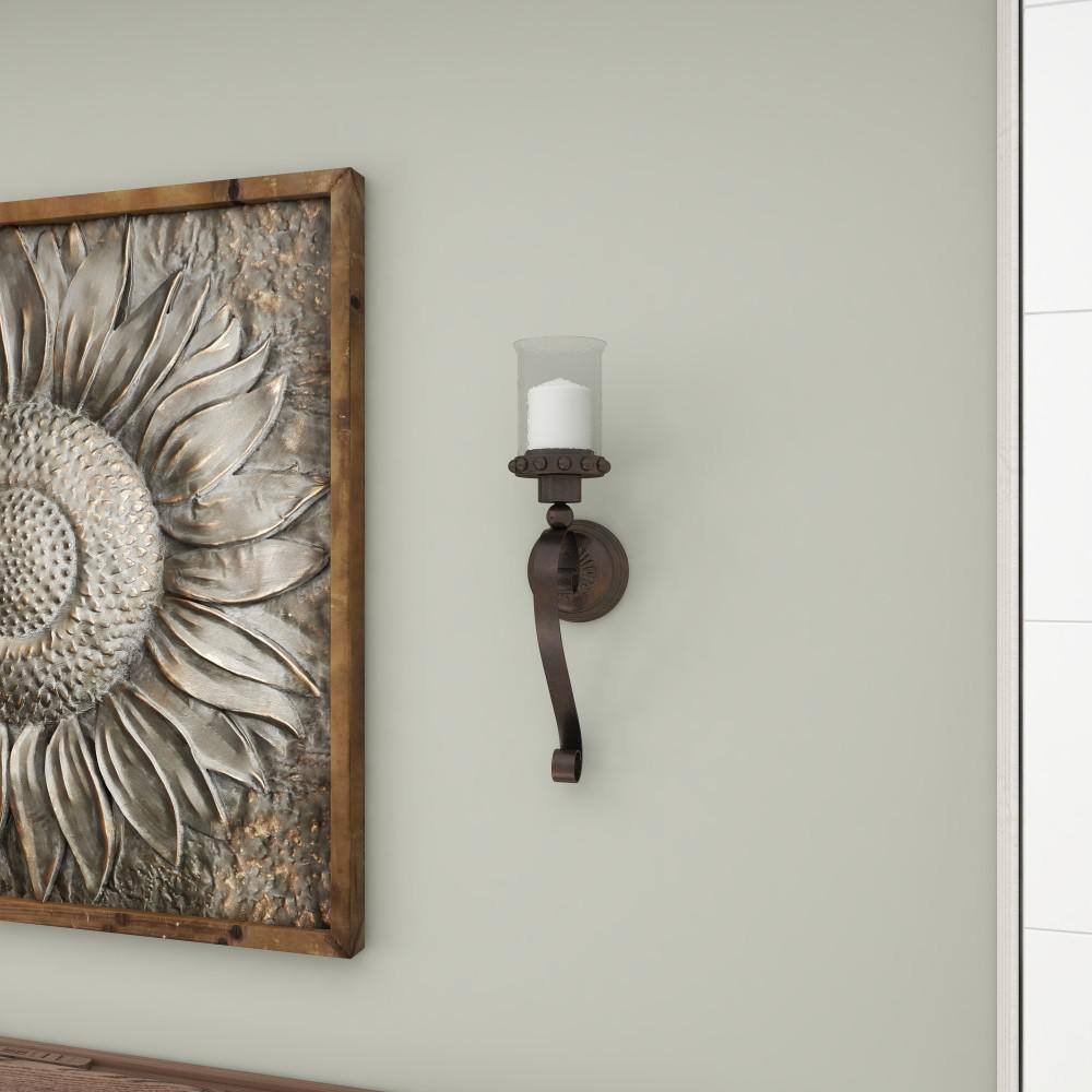 Brown Metal Scroll Wall Sconce with Glass Hurricane