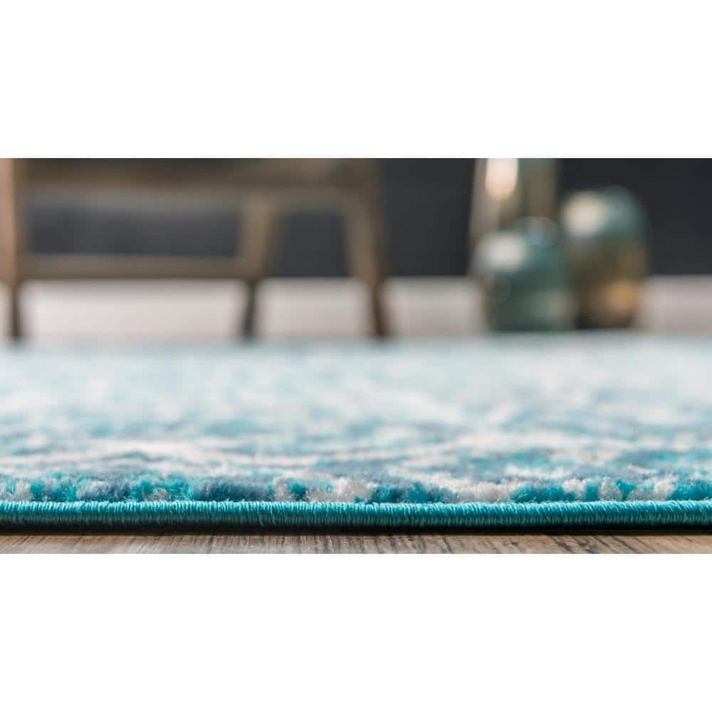 Turquoise and Ivory Geometric Synthetic Area Rug
