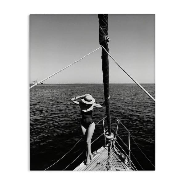 Stupell Industries Woman Posing on Boat by LSR Design Studio Unframed People Graphic Art Print 40 in. x 30 in.