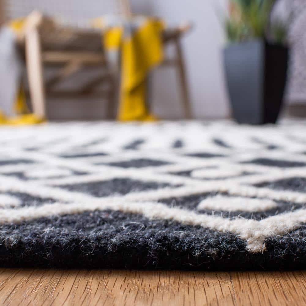 Black and Ivory 8' x 10' Handmade Wool Tufted Area Rug