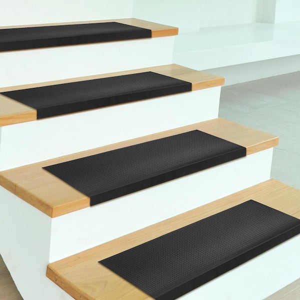 https://images.thdstatic.com/productImages/c7f5f656-a70a-436a-bee7-27a61c00ac18/svn/black-pin-ottomanson-stair-tread-covers-rdm8113-5pk-c3_600.jpg