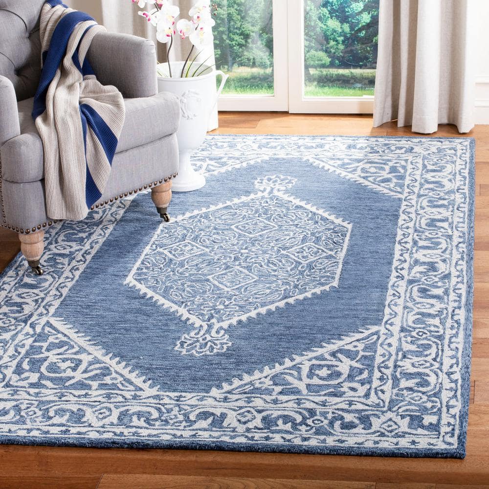 Blue and Ivory Tufted Wool 4' x 6' Area Rug