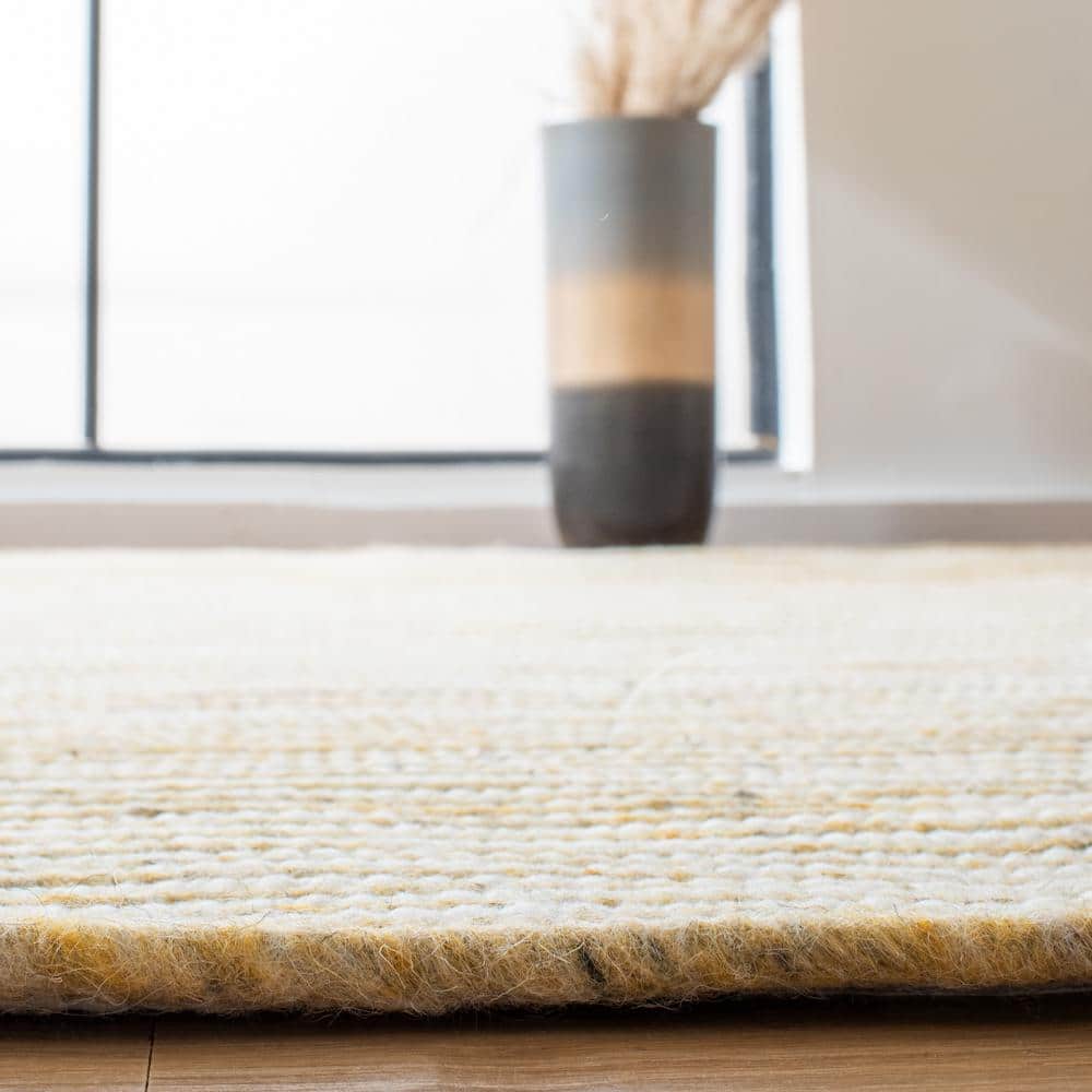 Handmade Gold and Ivory Round Wool Braided Area Rug