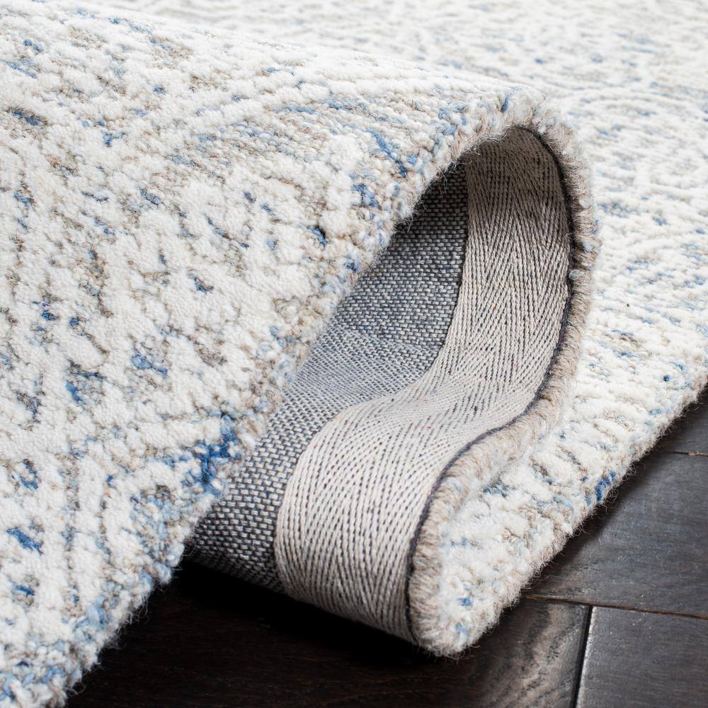 Light Blue and Ivory Floral Wool 8' x 10' Handmade Tufted Rug