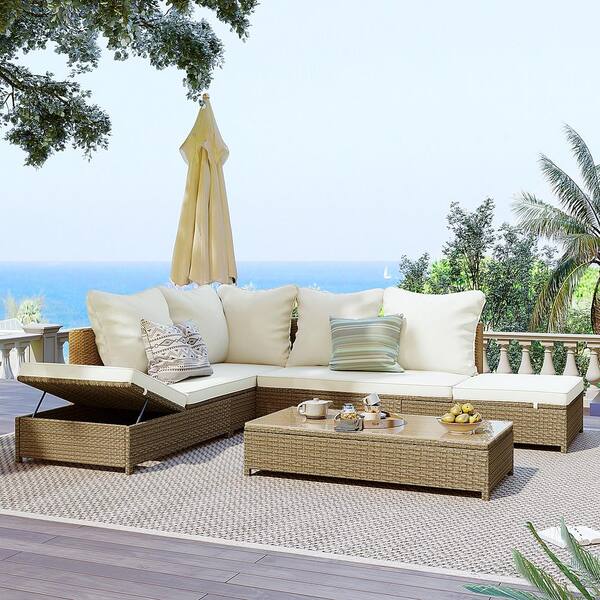 brown wicker outdoor sectional set with beige cushions