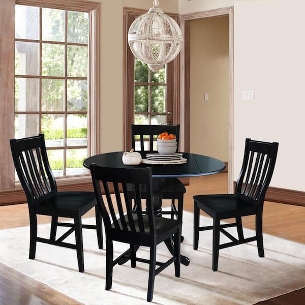 Black round deals table with chairs