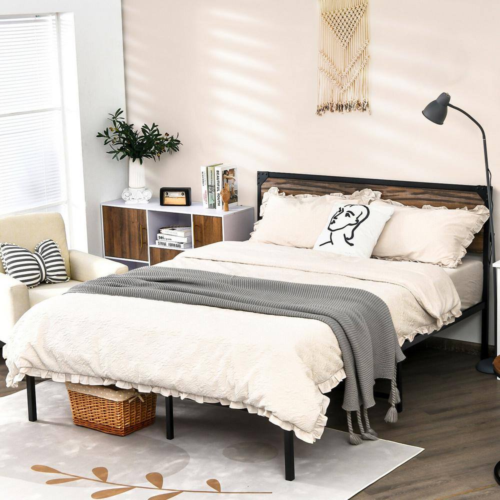 Bedroom styled with black and rustic wood metal bed.