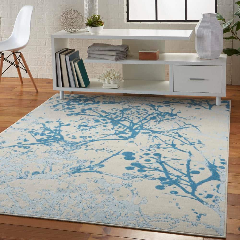 Ivory and Blue Abstract Synthetic 4' x 6' Easy-Care Area Rug