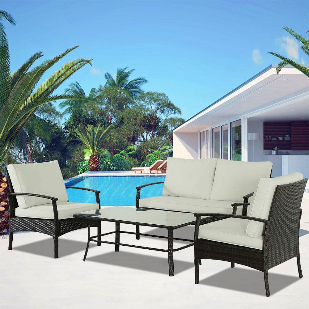 4-Piece Brown Wicker Outdoor Conversation Set with Large Table and Beige Cu