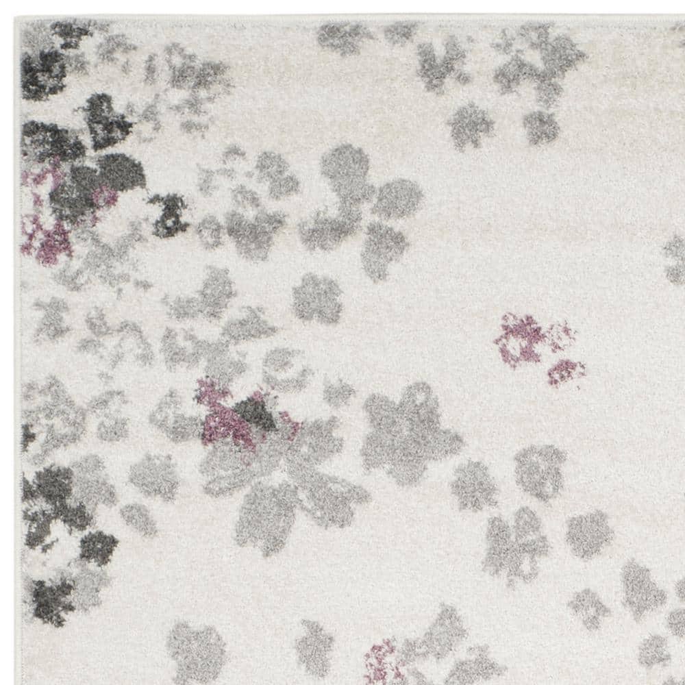 Ivory and Purple Floral Synthetic Area Rug, 6' x 9'