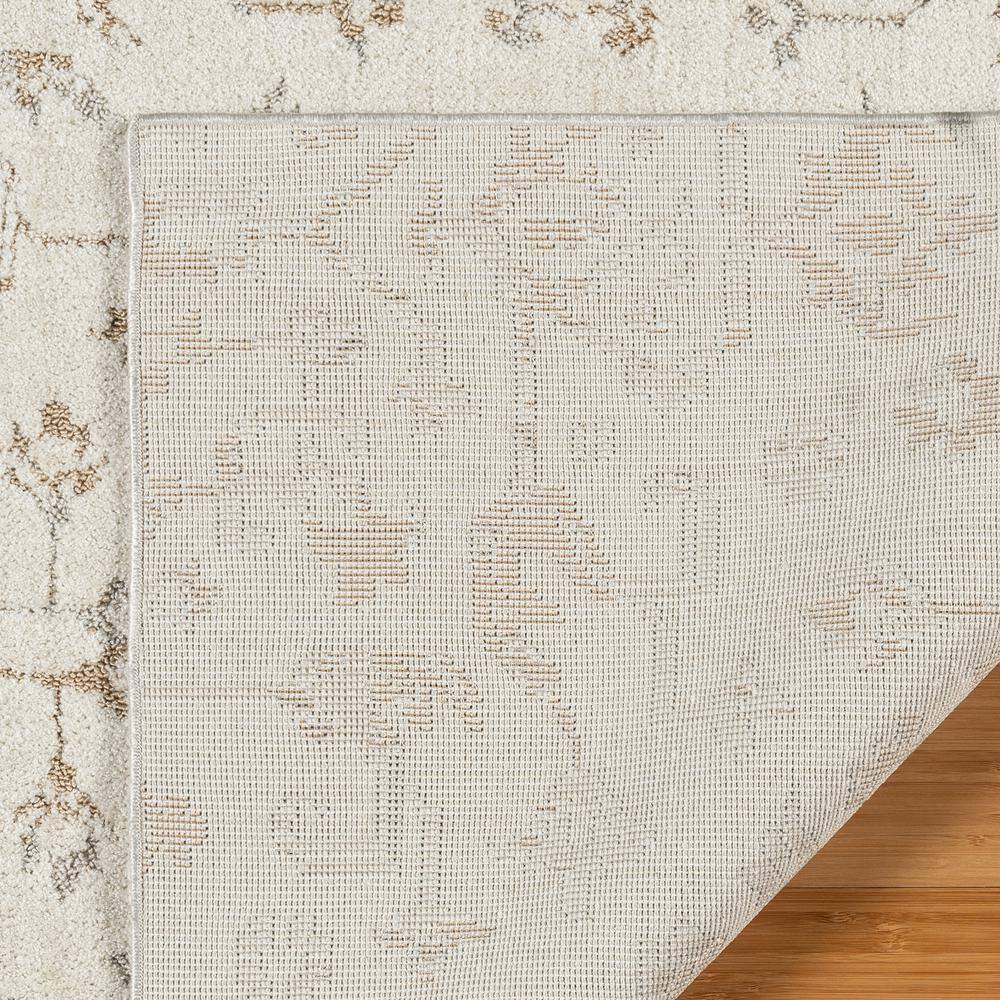 Joeri Cream Tufted Rectangular 5' x 7' Synthetic Area Rug