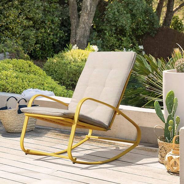 yellow metal rocking chair