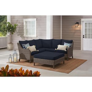 Windsor 4-Piece Brown Wicker Outdoor Patio Sectional Sofa with Ottoman and CushionGuard Midnight Navy Blue Cushions