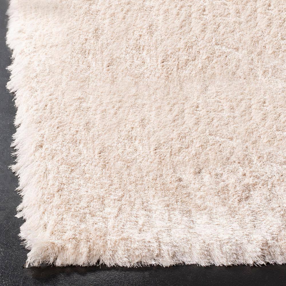 Ivory Tufted Shag 5' x 7' Wool and Synthetic Rug