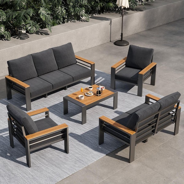 Stylish 5-Piece Black Aluminum Patio Seating Set with Comfortable Dark Gray Cushions and a Matching Table