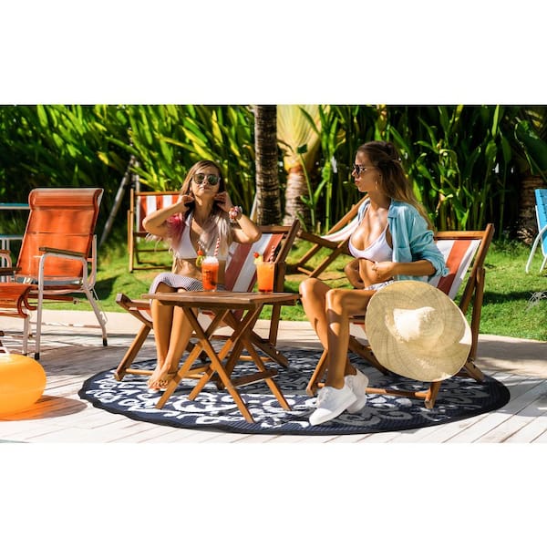 https://images.thdstatic.com/productImages/c9fb1a18-34fe-4fa5-9e58-b9c2d6b518f6/svn/blue-and-white-nuu-garden-outdoor-rugs-so04-01-77_600.jpg