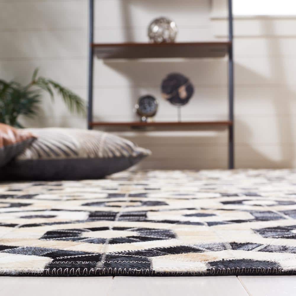 Handmade Black and Beige Geometric Cowhide Area Rug