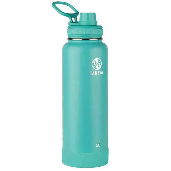 Rolled blue yoga mat and white metal water bottle flask grey