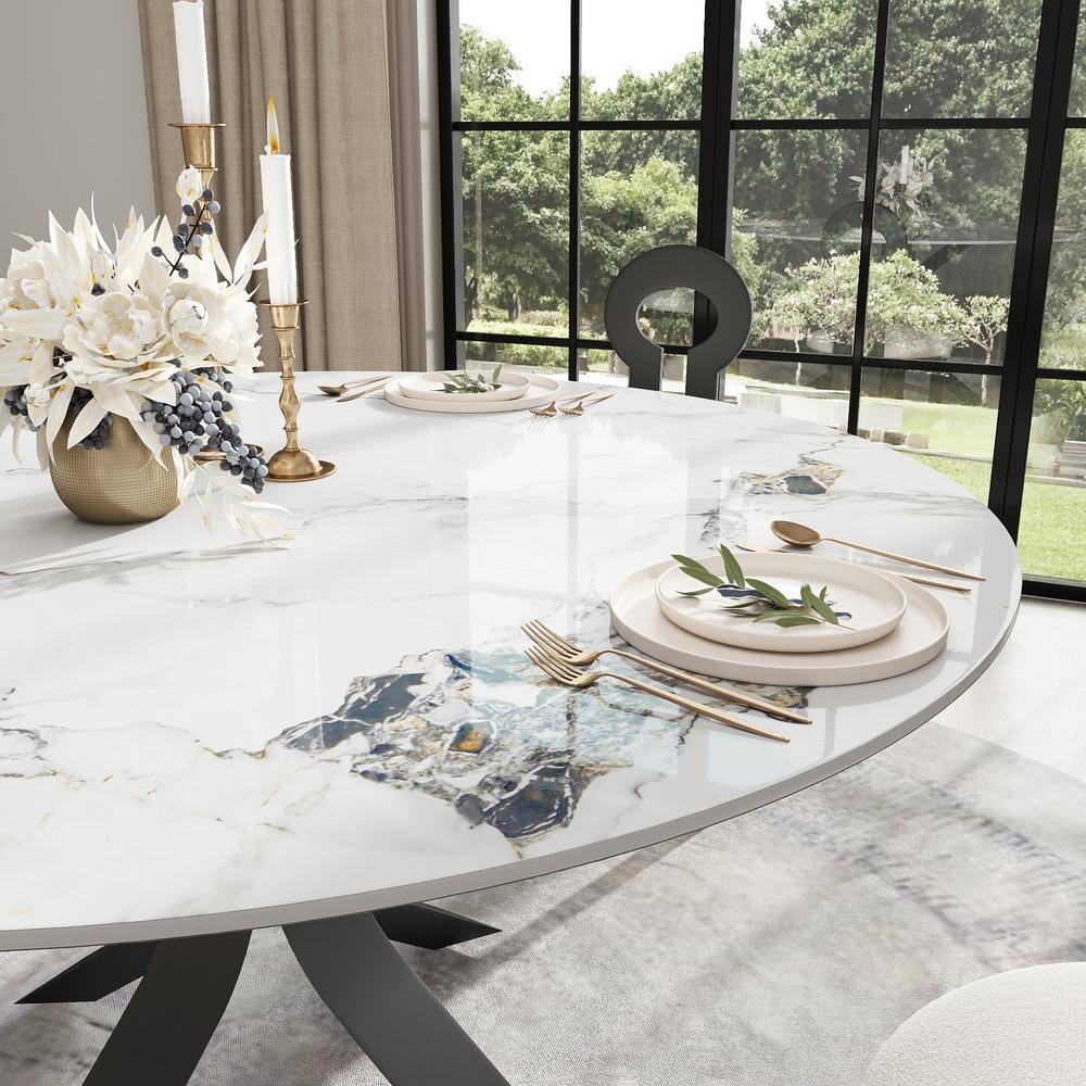 Close-up view of the white marble-patterned sintered stone tabletop of a dining table.