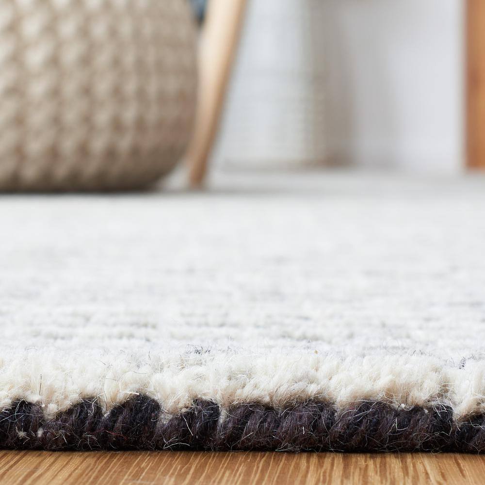 Handmade Black and Ivory Abstract Wool Area Rug, 5' x 8'