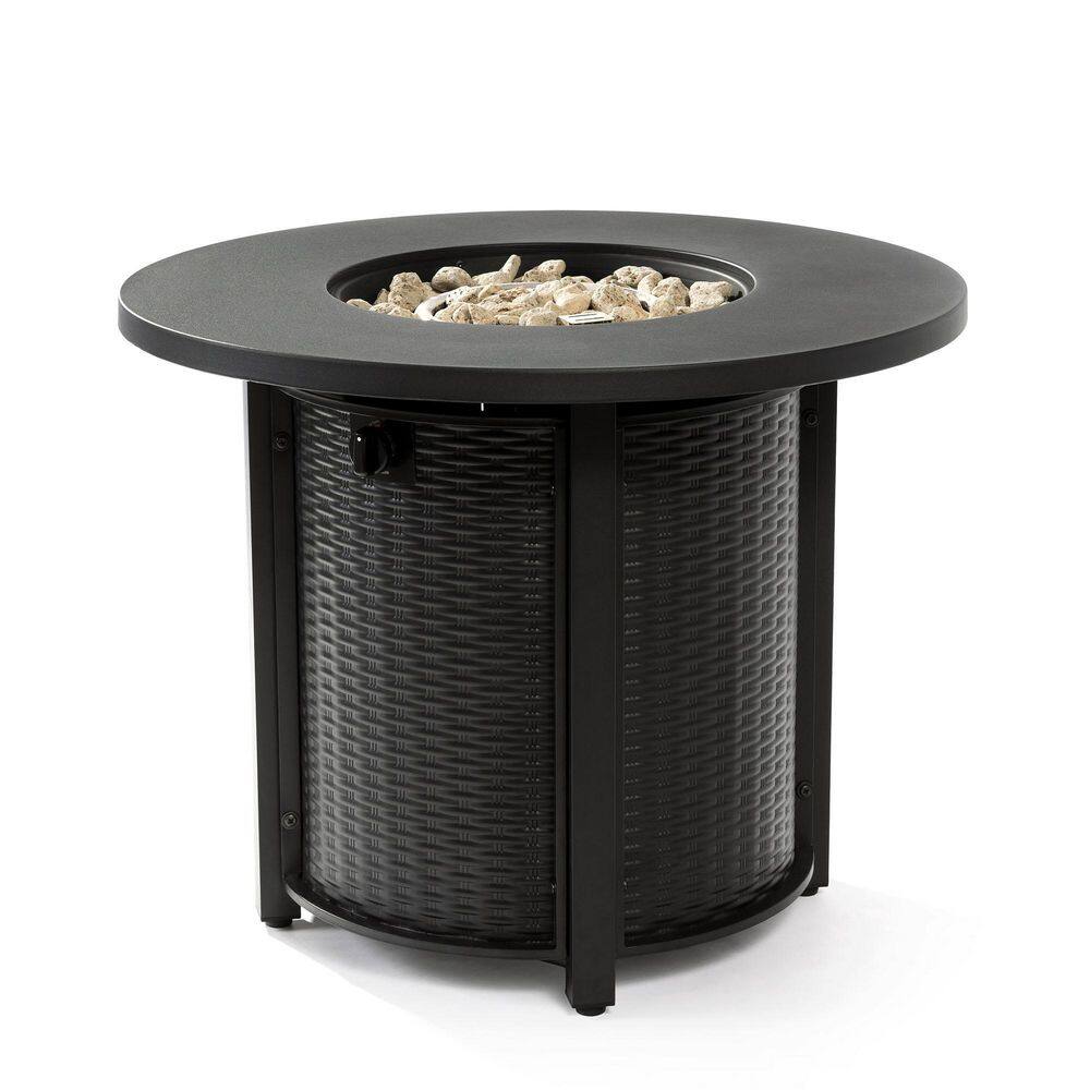 Black round steel outdoor fire pit table with lava rocks