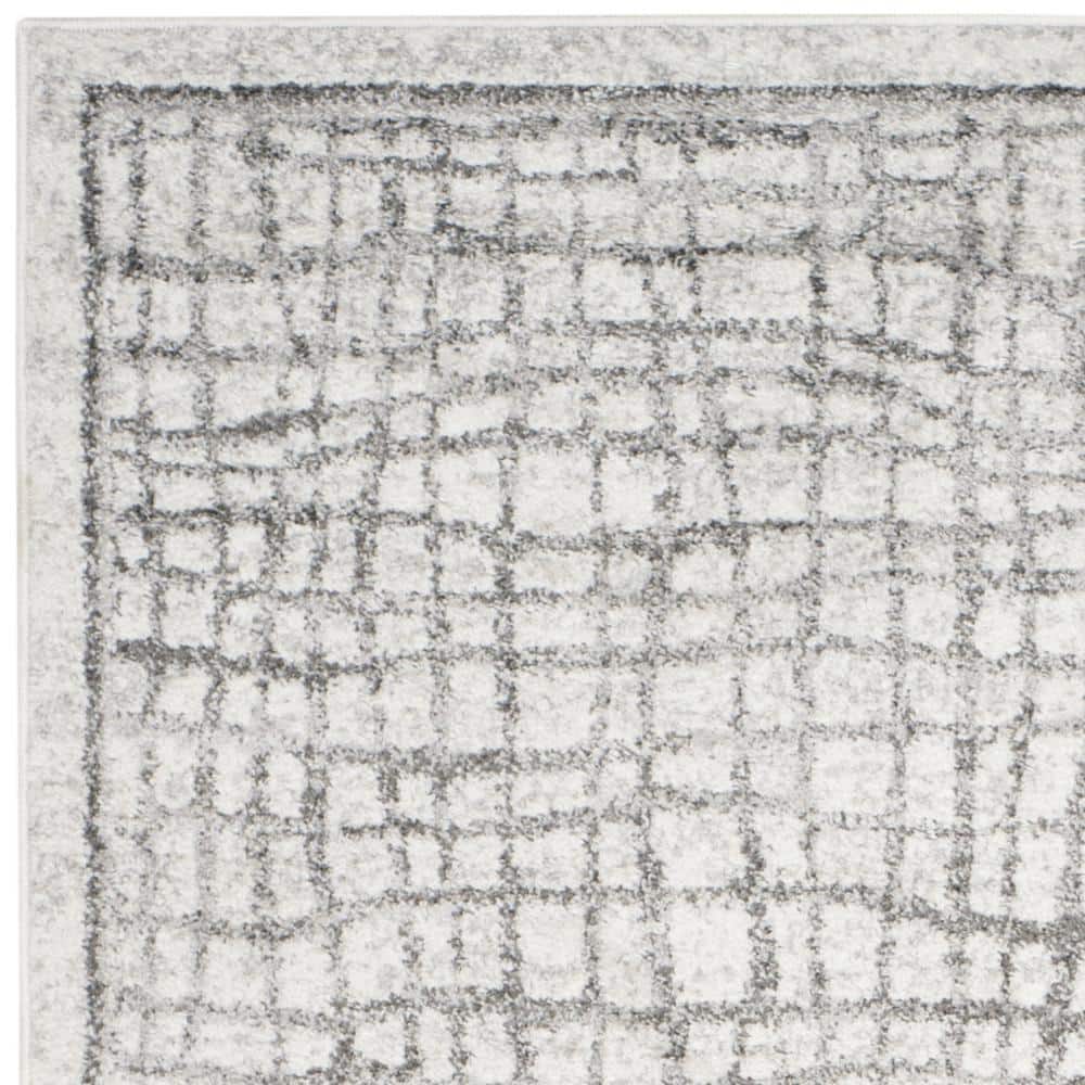 Ivory and Silver Rectangular Synthetic Area Rug, 6' x 9'