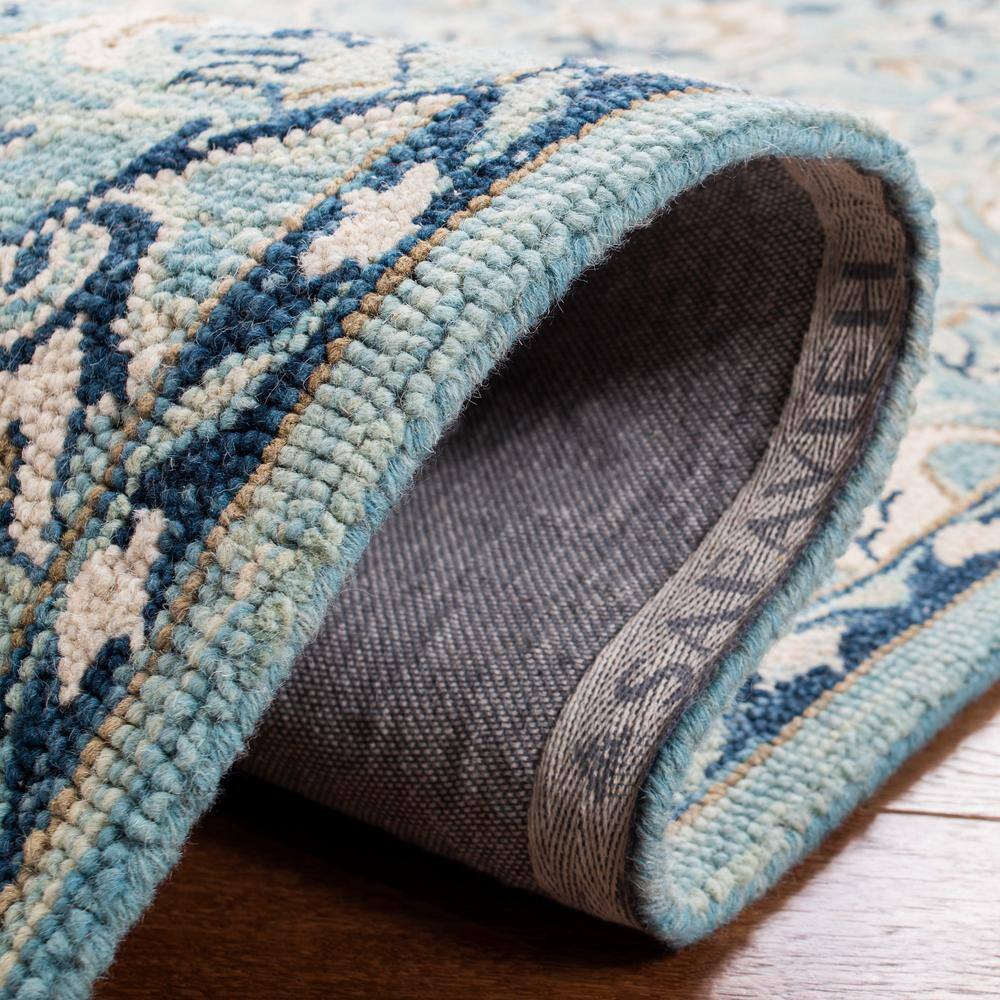 Blue and Ivory Floral Wool 9' x 12' Area Rug
