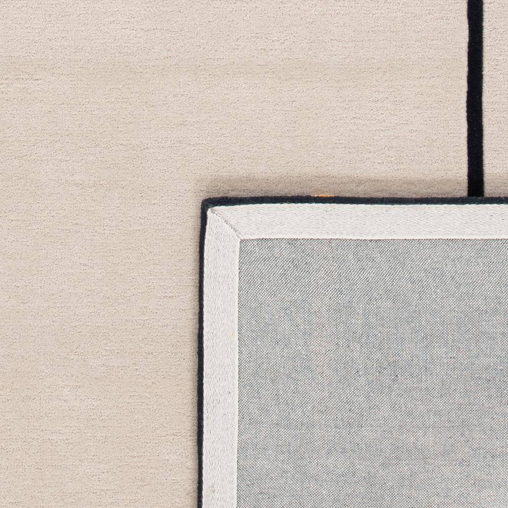 8' x 10' Black and Ivory Wool Abstract Tufted Rug