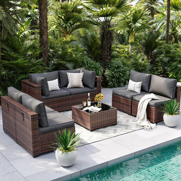 Poteban 7 Piece Rattan Sectional Seating Group with Gray Cushions