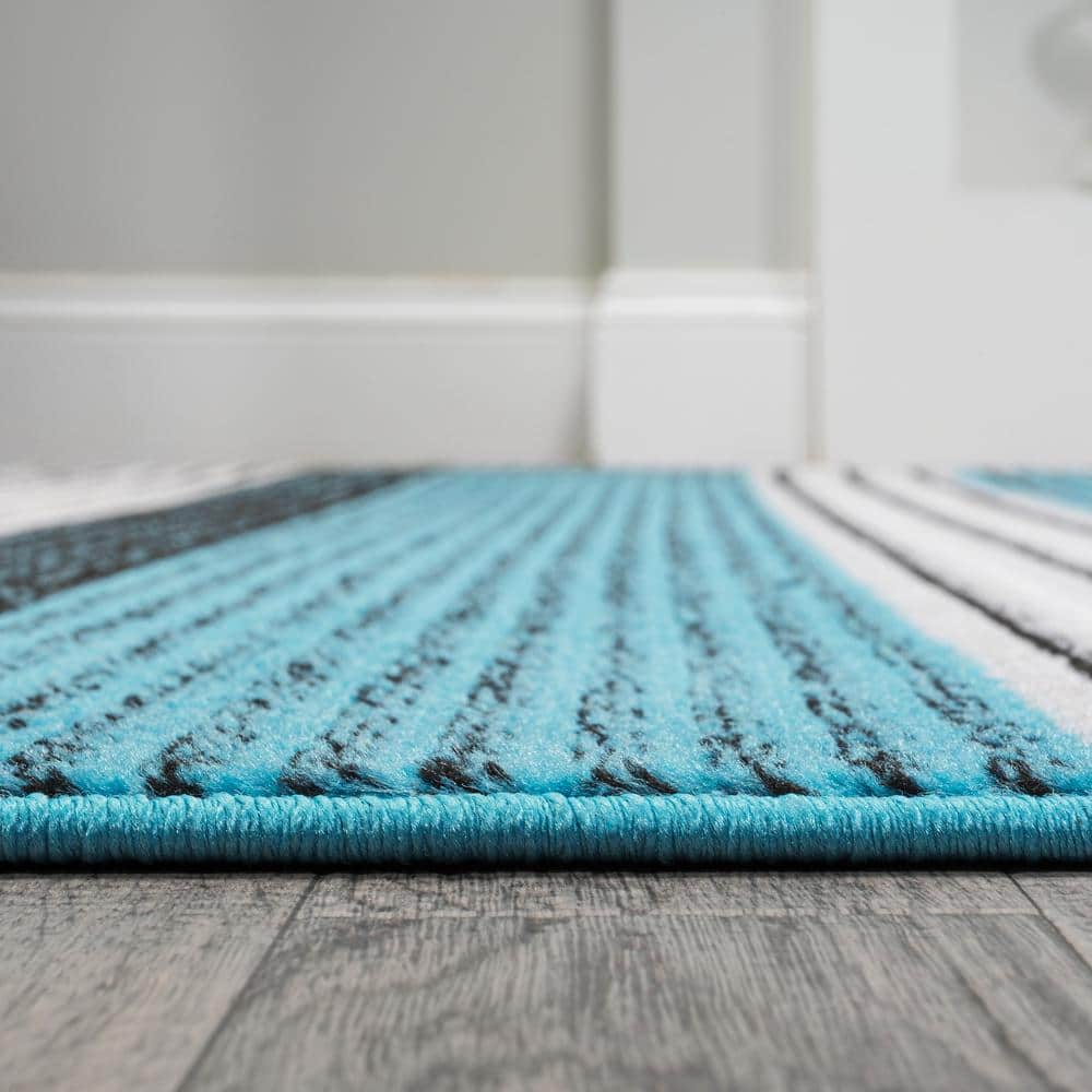 5' x 8' Blue and Navy Gradient Striped Synthetic Area Rug
