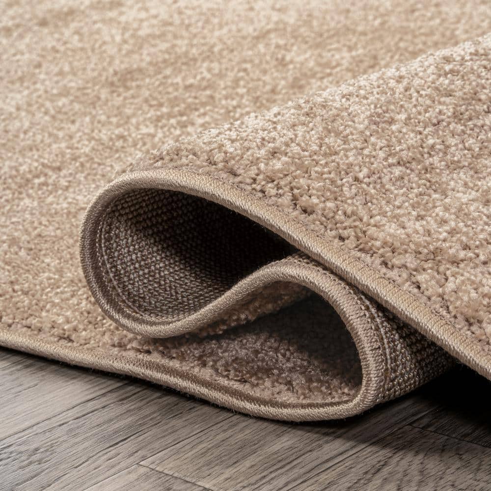 Beige 12' x 15' Solid Synthetic Low-Pile Area Rug