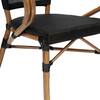 Close-up of the seat and frame of a brown and black outdoor dining chair.
