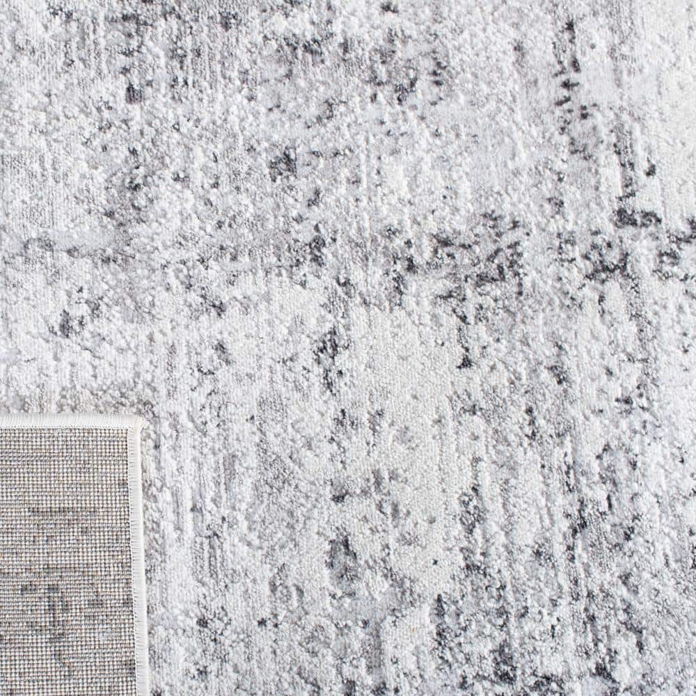 Ivory and Grey Abstract Round Synthetic Rug, 3' x 5'