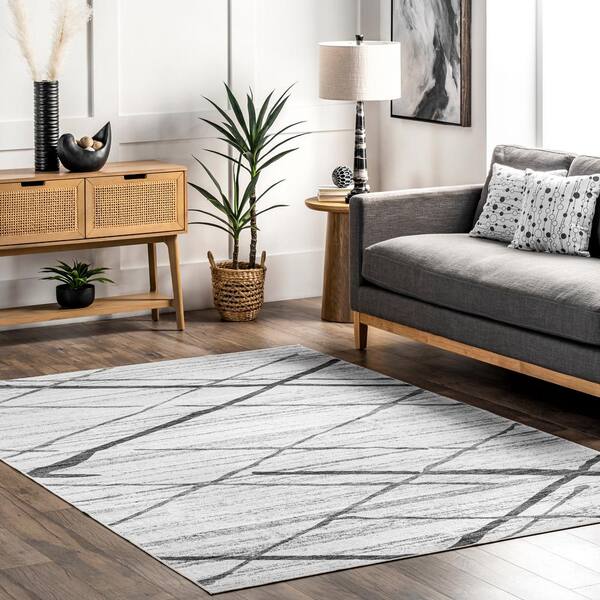 https://images.thdstatic.com/productImages/cb141e89-5d0d-46ad-95f6-79f62a1adfe2/svn/light-gray-nuloom-area-rugs-birv68a-8010-e1_600.jpg